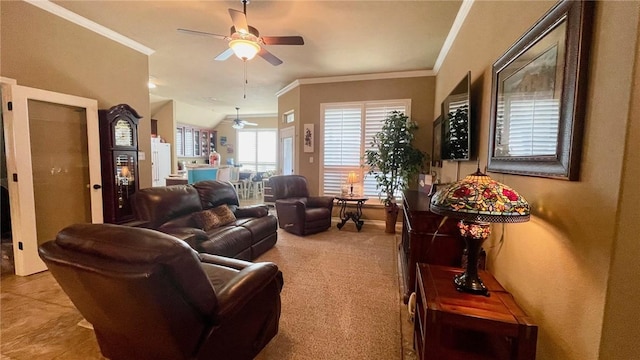 carpeted living room with ceiling fan and crown molding