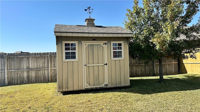 view of outbuilding featuring a yard