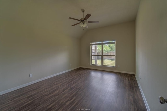 unfurnished room featuring dark wood finished floors, a ceiling fan, baseboards, and vaulted ceiling
