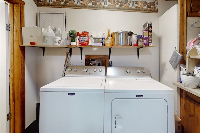 washroom featuring washing machine and dryer