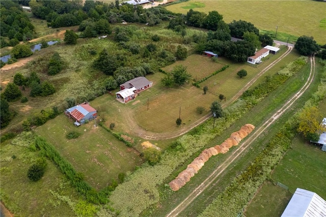 birds eye view of property with a rural view