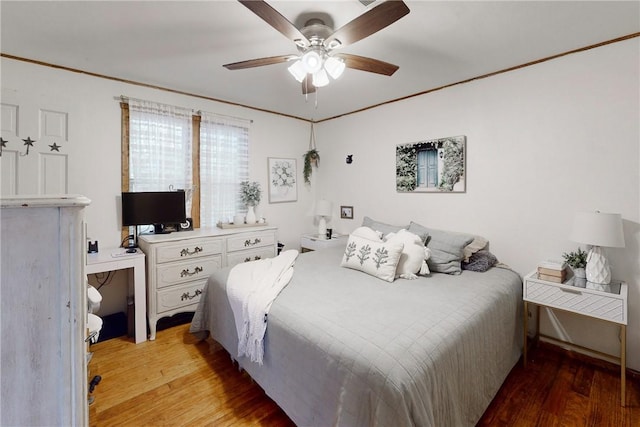 bedroom featuring hardwood / wood-style floors and ceiling fan