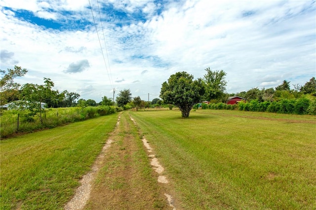 view of yard with a rural view