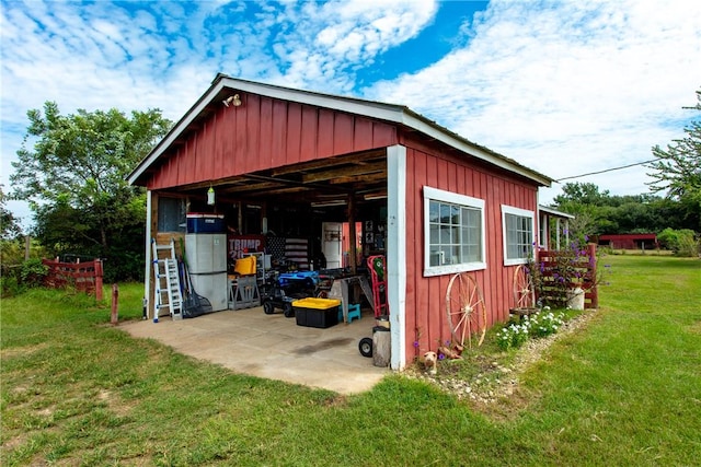 view of outbuilding featuring a yard