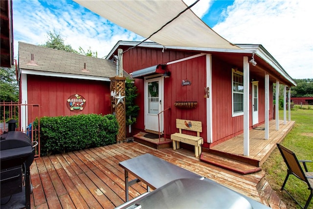 wooden terrace featuring area for grilling