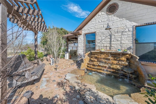 view of patio / terrace featuring a pergola