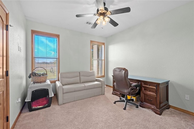 carpeted office featuring ceiling fan