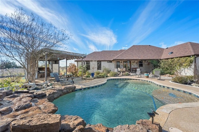 view of pool with a pergola and a patio