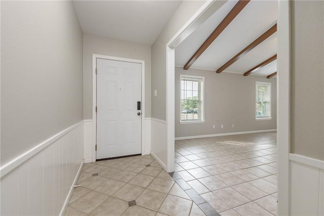 806 Matous Dr, Bryan, TX 77802 - entrance foyer with light tile patterned floors and wainscoting