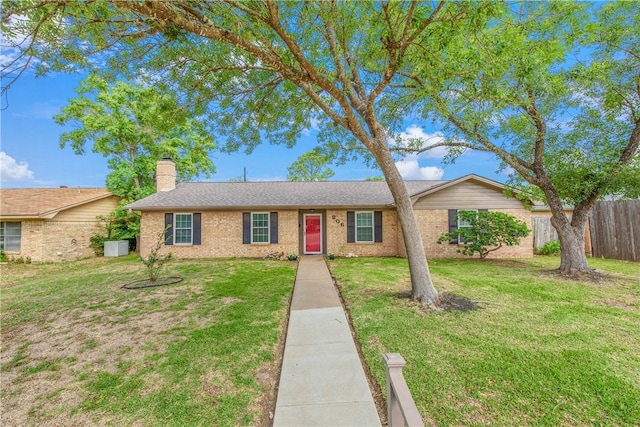 806 Matous Dr, Bryan, TX 77802 - single story home featuring a chimney and brick siding