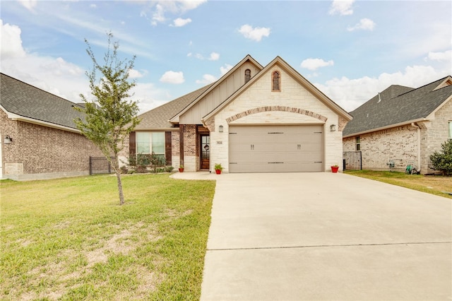 view of front facade with a front yard and a garage