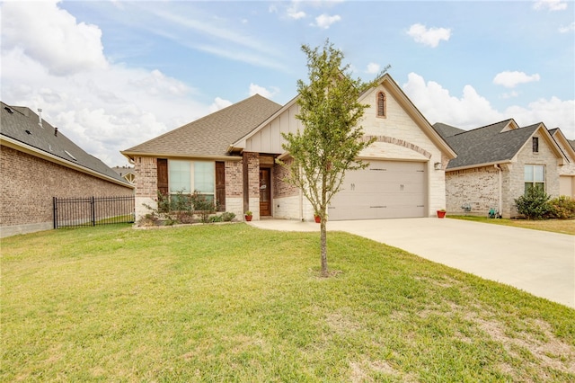 view of front of house with a garage and a front yard