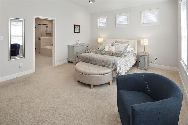 3609 Llano River Dr, College Station, TX 77845 - bedroom with light carpet, baseboards, vaulted ceiling, and connected bathroom
