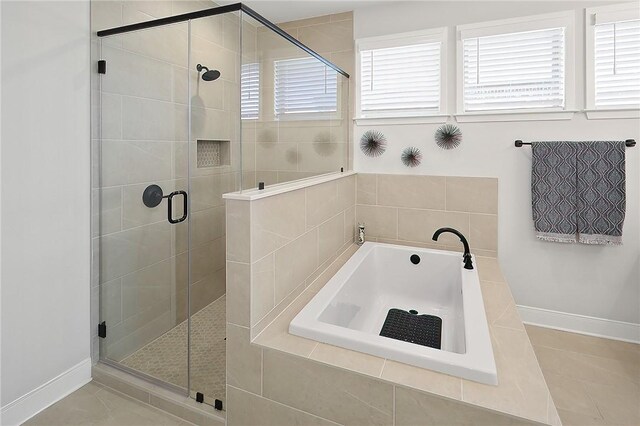 3609 Llano River Dr, College Station, TX 77845 - bathroom with a bath, a shower stall, baseboards, and tile patterned floors