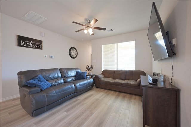 living room featuring light wood-type flooring and ceiling fan