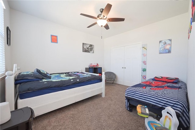 bedroom featuring carpet, ceiling fan, and a closet