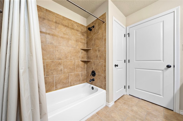 bathroom with tile patterned flooring, a textured ceiling, and shower / bath combo