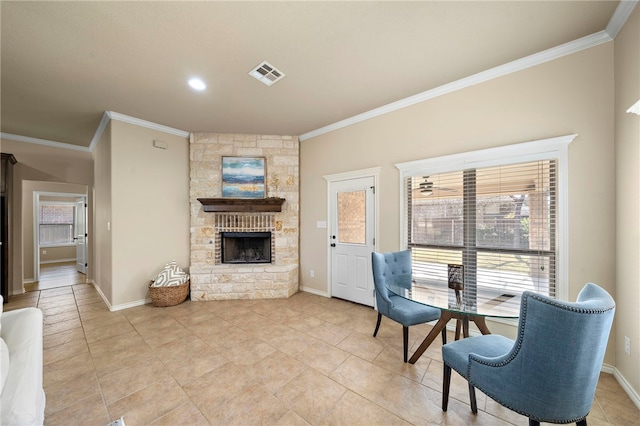 interior space featuring a fireplace, light tile patterned floors, and crown molding