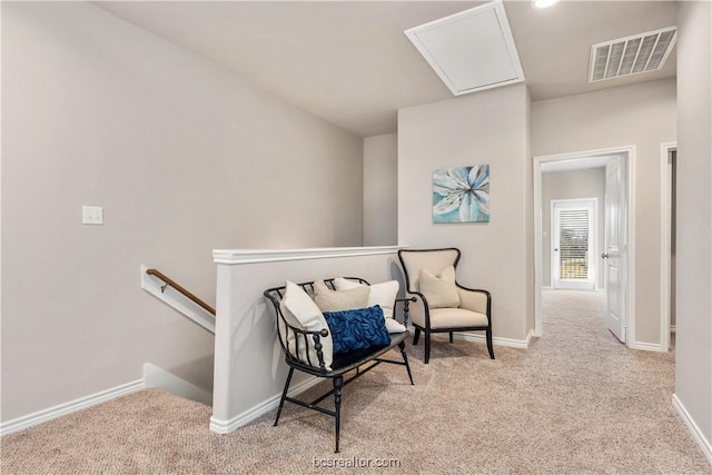 547 Hayes Ln, College Station, TX 77845 - living area with carpet, an upstairs landing, and attic access