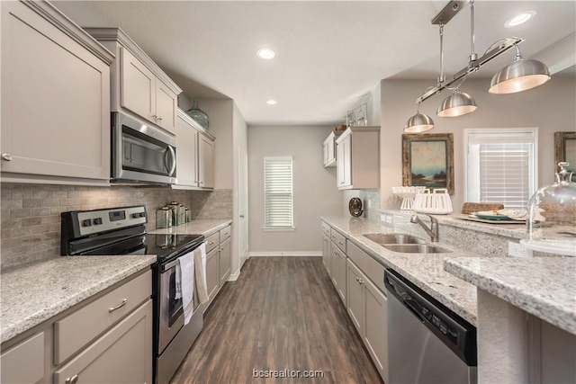 547 Hayes Ln, College Station, TX 77845 - kitchen with stainless steel appliances, backsplash, dark wood finished floors, light stone countertops, and recessed lighting