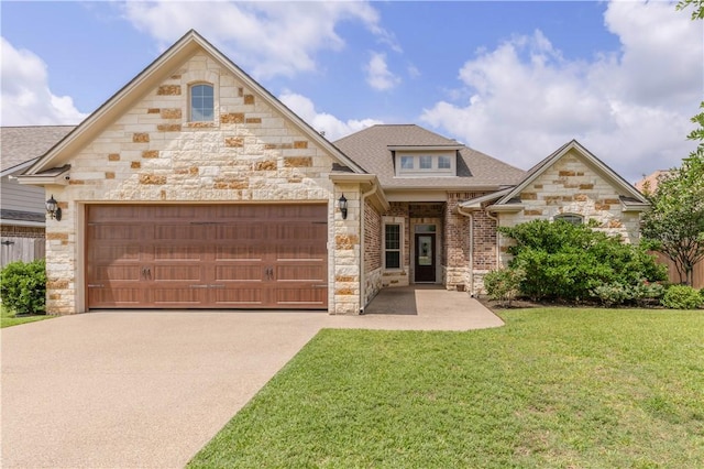 3520 Foxcroft Path, Bryan, TX 77808 - view of front of house featuring stone siding, a garage, driveway, a front lawn, and roof with shingles