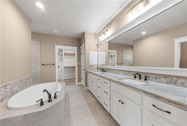 3520 Foxcroft Path, Bryan, TX 77808 - full bathroom featuring double vanity, a garden tub, and recessed lighting
