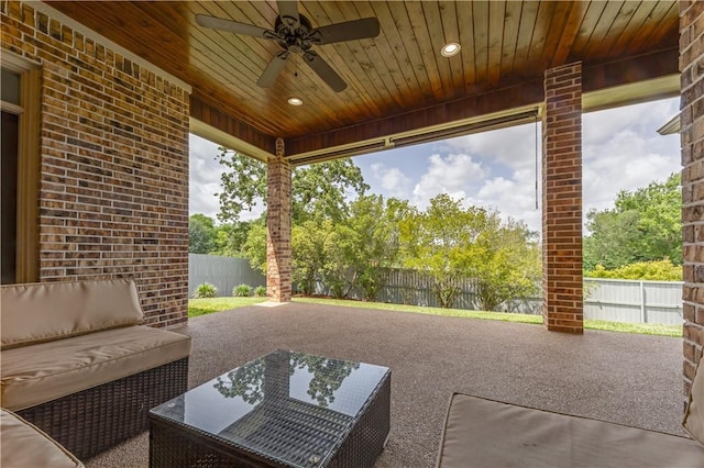 3520 Foxcroft Path, Bryan, TX 77808 - fenced backyard with a ceiling fan, an outdoor hangout area, and a patio