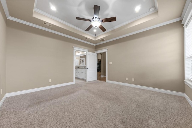 3520 Foxcroft Path, Bryan, TX 77808 - unfurnished bedroom with a tray ceiling, ornamental molding, light carpet, baseboards, and recessed lighting