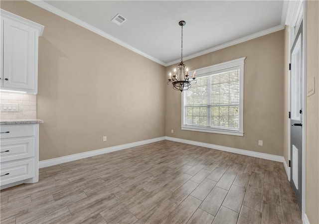 3520 Foxcroft Path, Bryan, TX 77808 - unfurnished dining area featuring a chandelier, light wood finished floors, ornamental molding, and baseboards