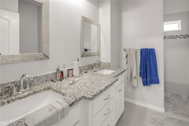 bathroom with tile patterned floors and vanity