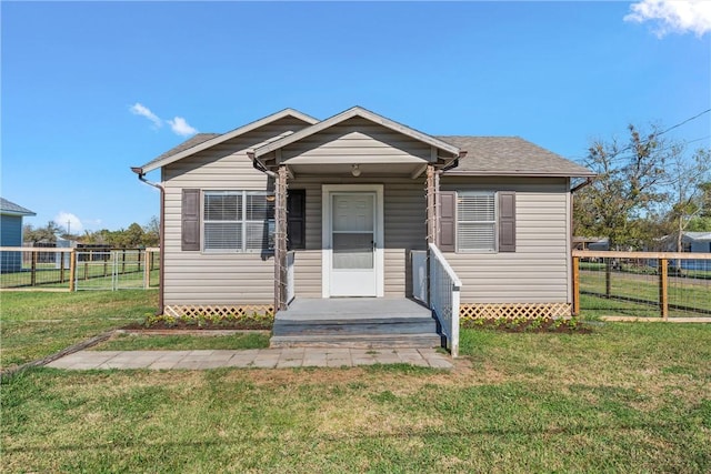 bungalow-style house featuring a front yard