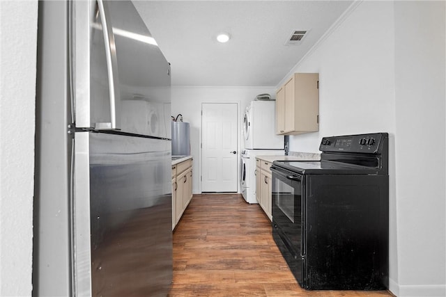 kitchen with black electric range, crown molding, stainless steel fridge, hardwood / wood-style floors, and washer / dryer