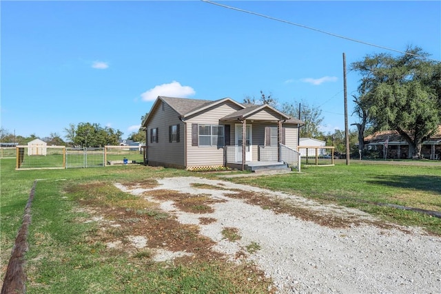 bungalow with a front lawn and a porch