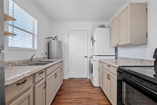 kitchen with black range with electric stovetop, sink, stacked washer and dryer, water heater, and dark hardwood / wood-style flooring