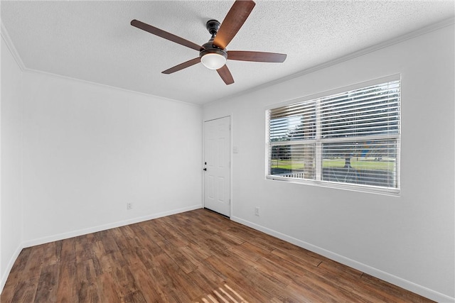 unfurnished room featuring ceiling fan, ornamental molding, a textured ceiling, and hardwood / wood-style flooring