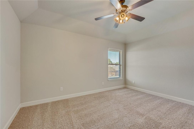 spare room featuring ceiling fan and carpet