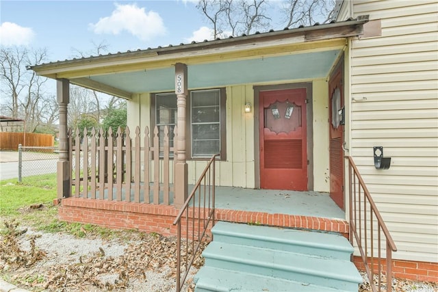 entrance to property with covered porch