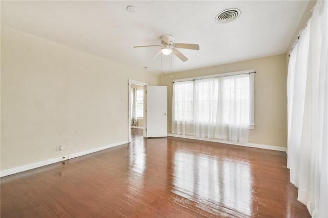 spare room with wood-type flooring and ceiling fan