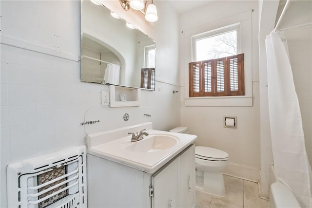 bathroom with vanity, tile patterned floors, toilet, and walk in shower