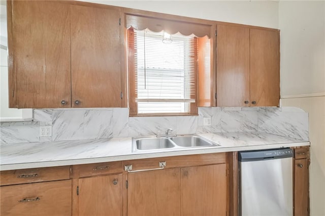 kitchen with dishwasher, sink, and decorative backsplash