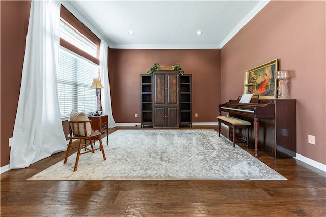 sitting room featuring ornamental molding, recessed lighting, wood finished floors, and baseboards