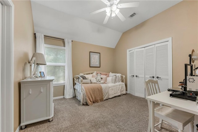 bedroom with light colored carpet, a closet, visible vents, and vaulted ceiling