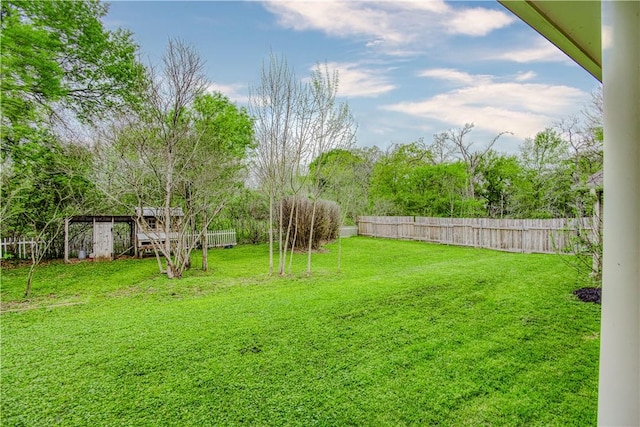 view of yard with a fenced backyard