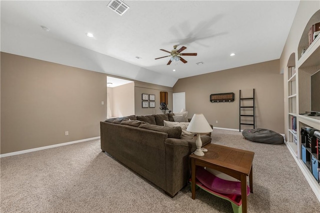 living area with carpet, lofted ceiling, visible vents, a ceiling fan, and baseboards