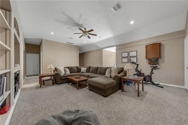 living room with recessed lighting, visible vents, light carpet, and baseboards