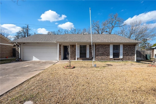 single story home with a garage and a front yard