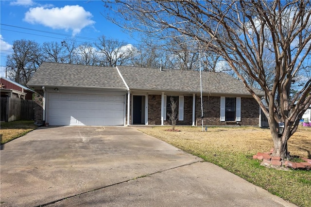 single story home with a garage and a front yard