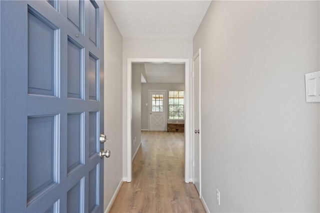 corridor featuring light hardwood / wood-style flooring