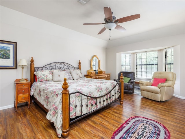 bedroom featuring ceiling fan and dark wood-type flooring