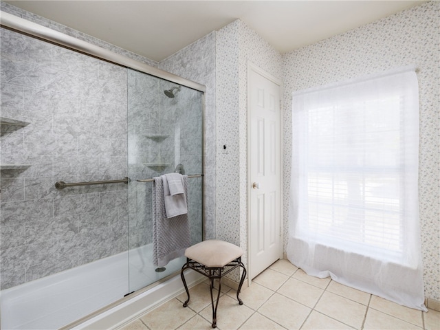 bathroom featuring tile patterned flooring and a shower with door